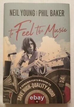 Neil Young & Phil Baker Autographed To Feel The Music 1st Edition Book